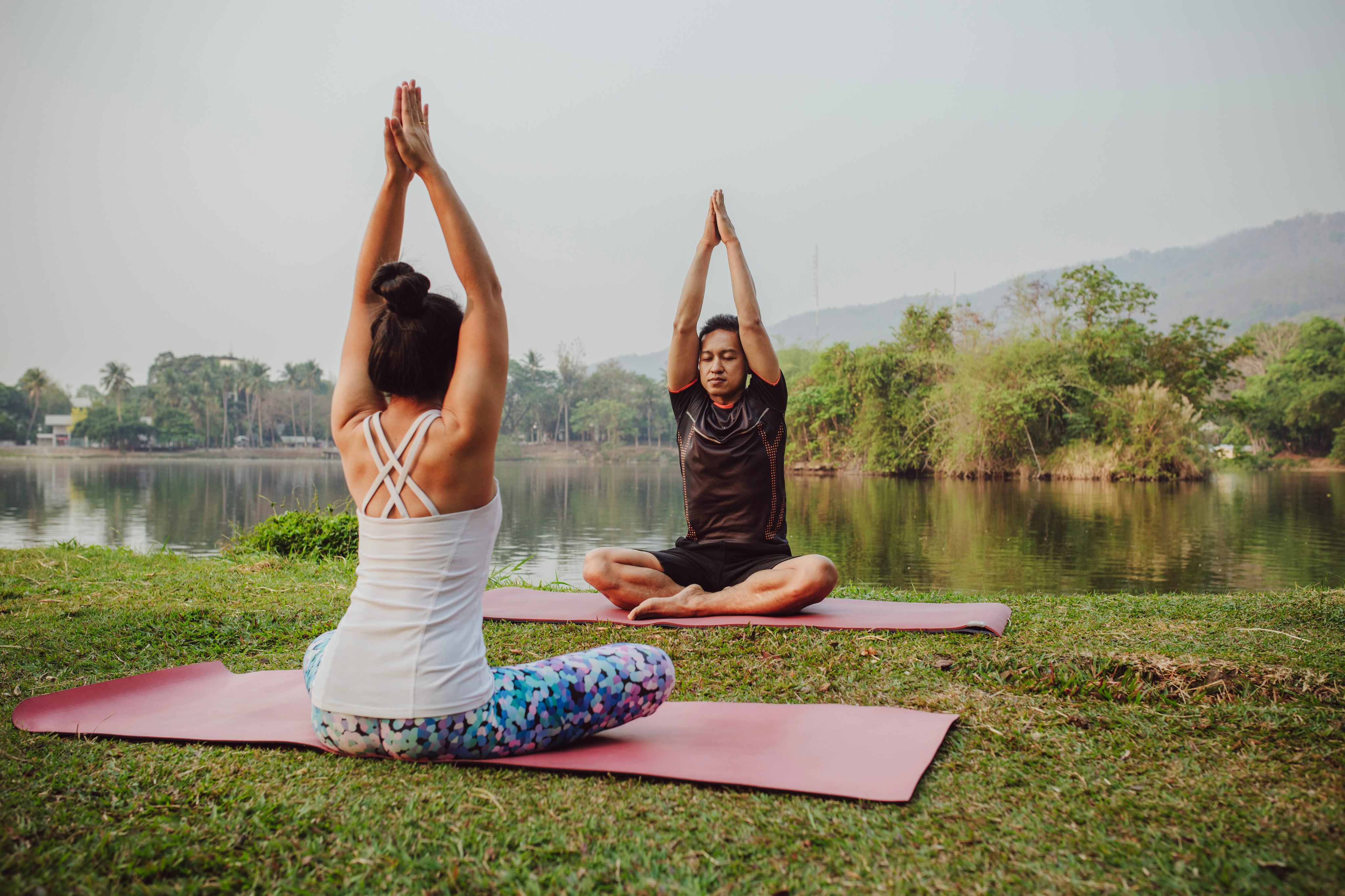 People practicing yoga outdoors